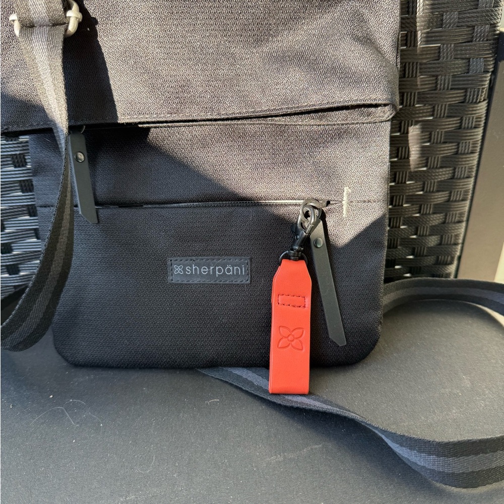 Sherpani Black Messenger Bag with orange Detail